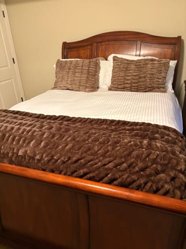 Customer's bed made with two textured Hugs Milk Chocolate Shams and a matching blanket over a white duvet.