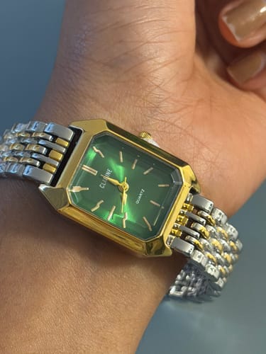 Customer's CLAIRE DE MAINS watch on their wrist, showing the green face and two-tone metal strap.