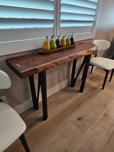 Customer's console table with a live-edge top and black metal legs, installed using the product's hardware.
