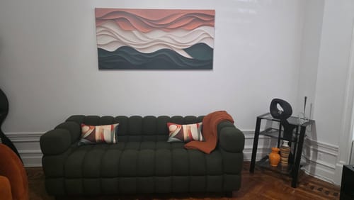 Customer's Minimalist Wall Art VI with an abstract, wavy design hanging above a sofa in a living room.