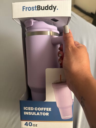 Customer holding the lavender Thicc Buddy 40oz mug in its original packaging.