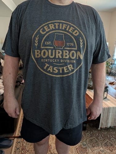 Reviewer wearing the dark grey Certified Bourbon Taster T-Shirt to show the fit.