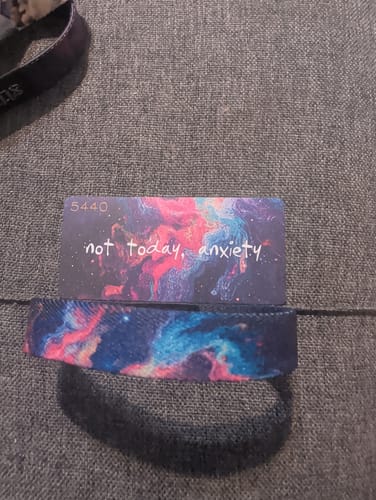 Customer's 'Not Today, Anxiety' bracelet showing its colorful galaxy pattern, displayed with its matching inspirational card.