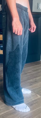 Customer's 2099 - Batman Stealth Sweats in black, showing the baggy fit and large tonal bat emblem on the leg.