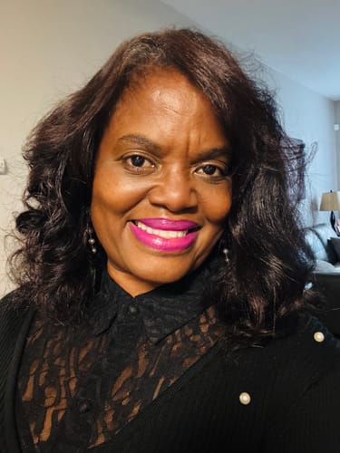 Customer's glowing, hydrated skin after using GLO MELANIN skincare products.