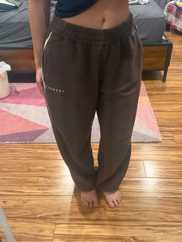 Customer's brown Streak Joggers with elastic waistband and deep pockets, showing a slouchy fit.