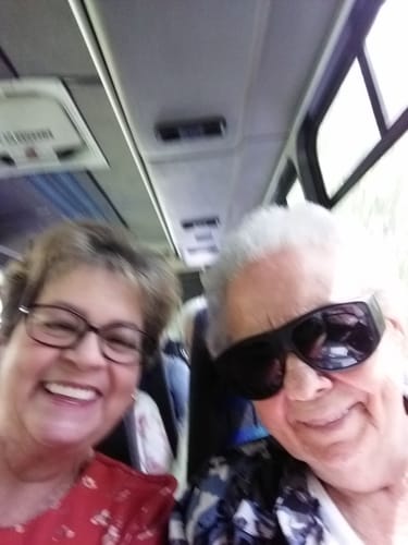 Customer's selfie on a bus, showing the reviewer who uses Deep Collagen Cream, smiling.