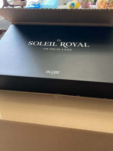 Customer's Soleil Royal maqueta packaging, featuring clear brand lettering on the black box lid.