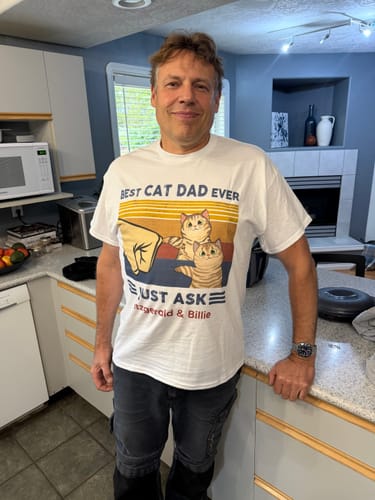Customer's man wearing a personalized white Perfect Gift for Cat Dads t-shirt with a cat fist bump graphic.
