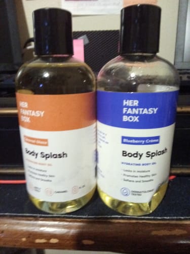 Customer's Skin Smoothing Body Oil bottle in Caramel Glaze next to another Body Splash bottle.