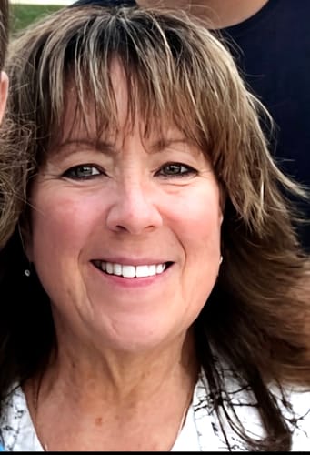 Customer's smiling face demonstrating healthy, rejuvenated skin after using The Micro Infusion System.