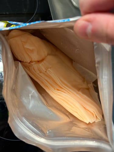 Reviewer's close-up of the Kose Clear Turn Whitening Skincare Masks, showing the tight stack inside the package.