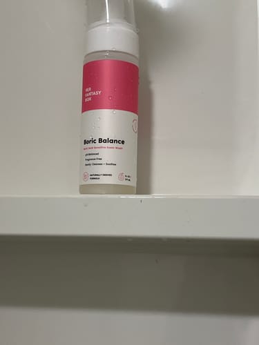 Customer's Boric Balance foam wash bottle sitting on a white shower shelf.