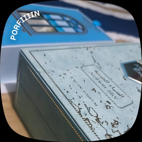 Customer's Eter Arabian Sky perfume box in a close-up, showing blue tones and elegant printed text.