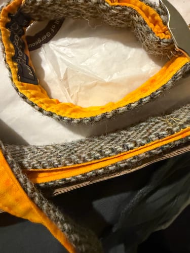 Customer's Oxford Tweed dog lead, close-up showing the textured fabric and bright orange padded handle.