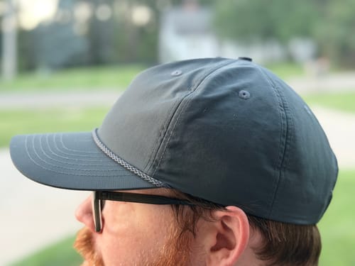 Customer's grey Big Lightweight Nylon Hat, side profile view showing the mid profile crown