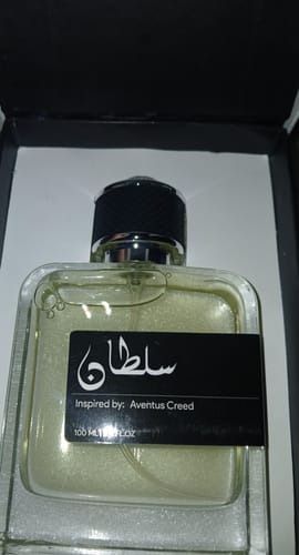 Customer's Sultan perfume bottle with a black cap and label, displayed in its original black box.