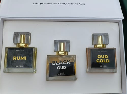 Customer's Royal Oud Collection set with three perfume bottles labeled Rumi, Black Oud, and Oud Gold inside a box.