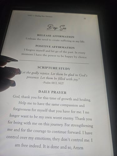 Customer's Daily Affirmations for Healing ebook displayed on a screen with Day Six text visible.