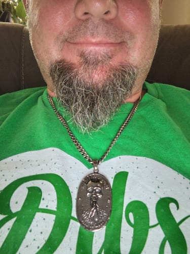 Customer wearing the silver Memento Mori Vita Et Mors necklace with a skull medallion on a chain.