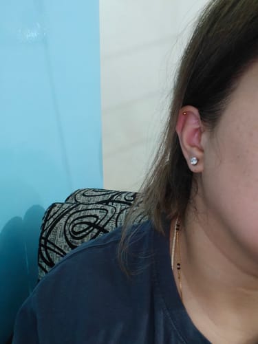Customer's Silver Zircon Mini Studs worn on an earlobe.