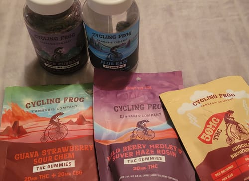 Reviewer's Cycling Frog products, including Black Currant Nighttime Gummies and other flavor pouches.