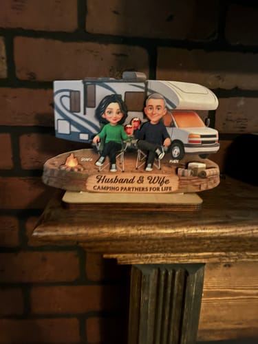 Customer's personalized wooden camping plaque displayed on a home mantelpiece