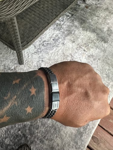 Customer's USA 250th Anniversary bracelet on wrist, featuring a dark metal accent piece.
