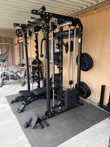 Customer's black Major Fitness B52 All-In-One Home Gym machine set up on a floor mat in a garage.