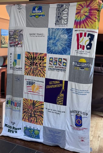 Customer's Project Repat T-Shirt Quilt featuring a patchwork of colorful tennis tournament shirts.