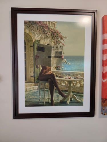 Customer's La Dolce Niente N02 art print in a dark frame, displayed on a wall