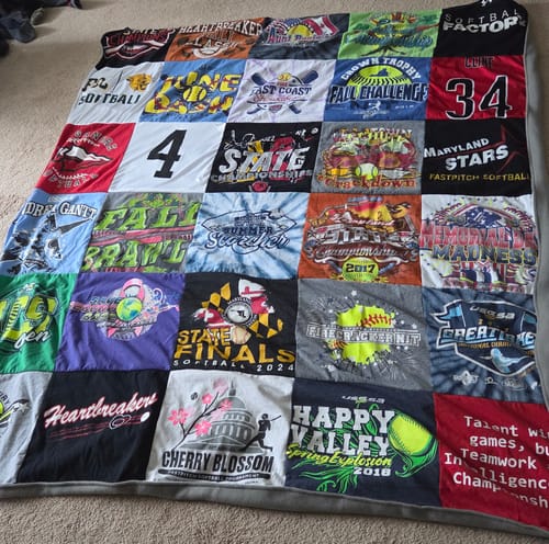Customer's Project Repat T-Shirt Quilt displaying a colorful collage of various softball team shirts.