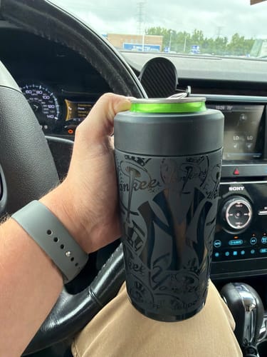 Customer's New York Yankees Universal Buddy can cooler held in a hand while driving in a vehicle.