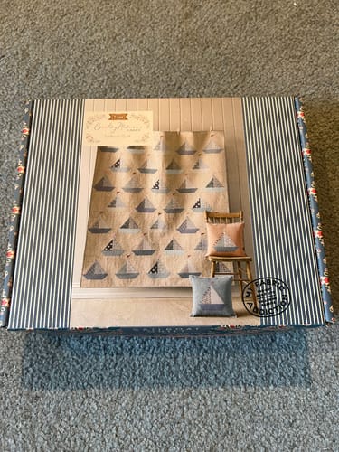Customer's Tilda Sailboat Quilt Kit box showing a picture of the finished sailboat quilt on the front.