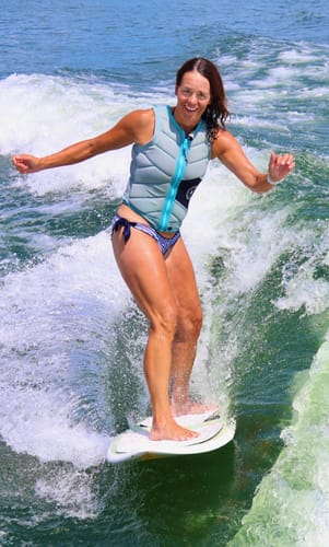 Customer's CUURT Muuv court shoes being worn while wakesurfing on a lake.