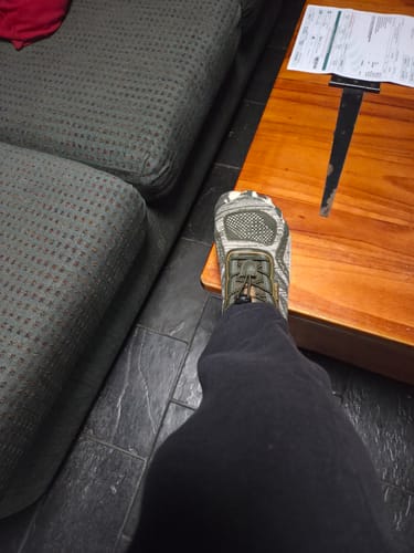 Customer's Active II Pro barefoot shoe with camouflage pattern worn on foot inside a room.