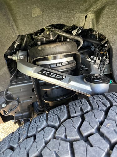 Customer's silver Aluminum Upper Control Arm installed on a Chevy Silverado or GMC Sierra front suspension.