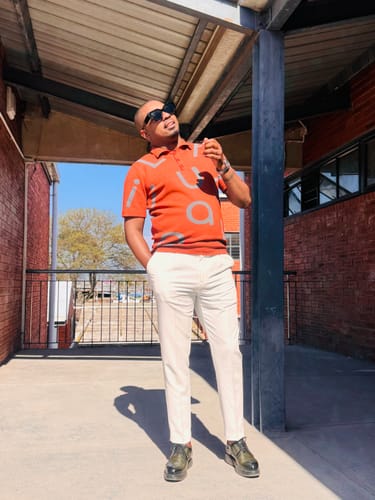 Customer's Lufiano Lace up shoes in olive worn with white trousers and orange shirt