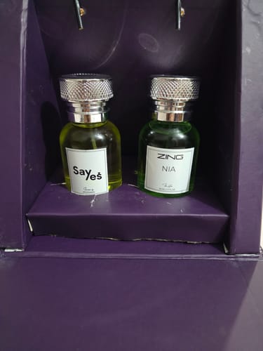 Customer's Box for Her perfume set, showing two small fragrance bottles inside a dark purple display case.
