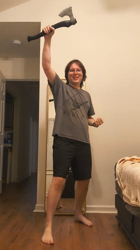 Customer's Sterk Vorley axe held high in a room