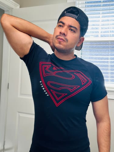 Customer's Superman Compression Tee worn, showing the black and red design with a fitted look.