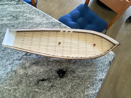 Customer's wooden Polaris model ship deck partially constructed on a speckled surface.