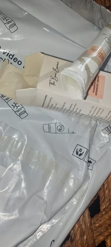 Reviewer's All Glow Pigmentation Bundle cream tube and open packaging box, showing product contents