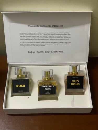Customer's Royal Oud Collection box containing three square glass perfume bottles with black labels.