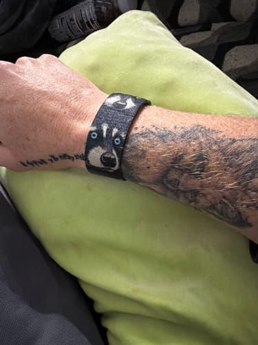 Customer's Trash Pandas Mystery Bracelet worn on wrist, featuring a detailed raccoon face design.