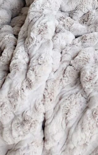 Reviewer's Ultra Sorbet Silver Cloud blanket, showing a close-up of the thick, textured silver material.