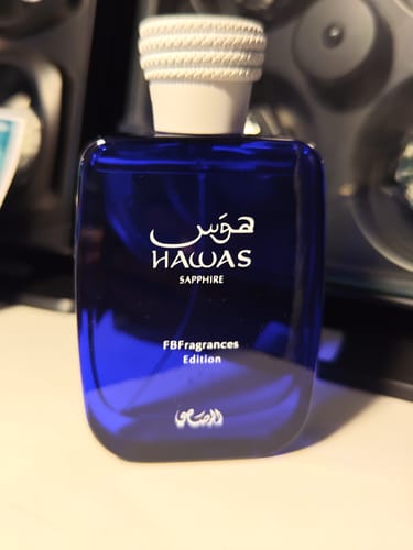 Customer's Hawas Sapphire perfume bottle, a square blue glass container with a white textured cap.