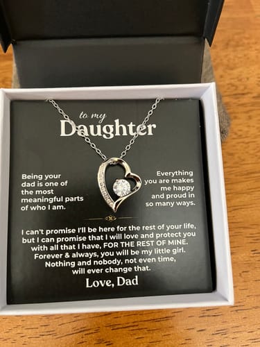 Customer's To My Daughter gift set showing a silver heart necklace and heartfelt message card inside an open box.