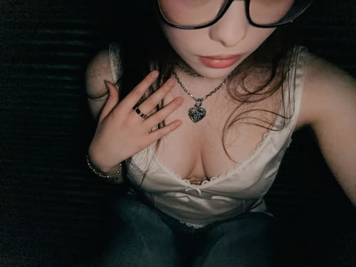Customer's Aries Chain worn as a necklace with a heart pendant, showing silver tone metal links.