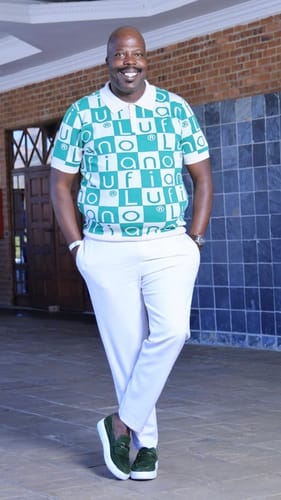Customer's LFN007 knit top with a checkered green and white pattern, worn with white trousers by a person.
